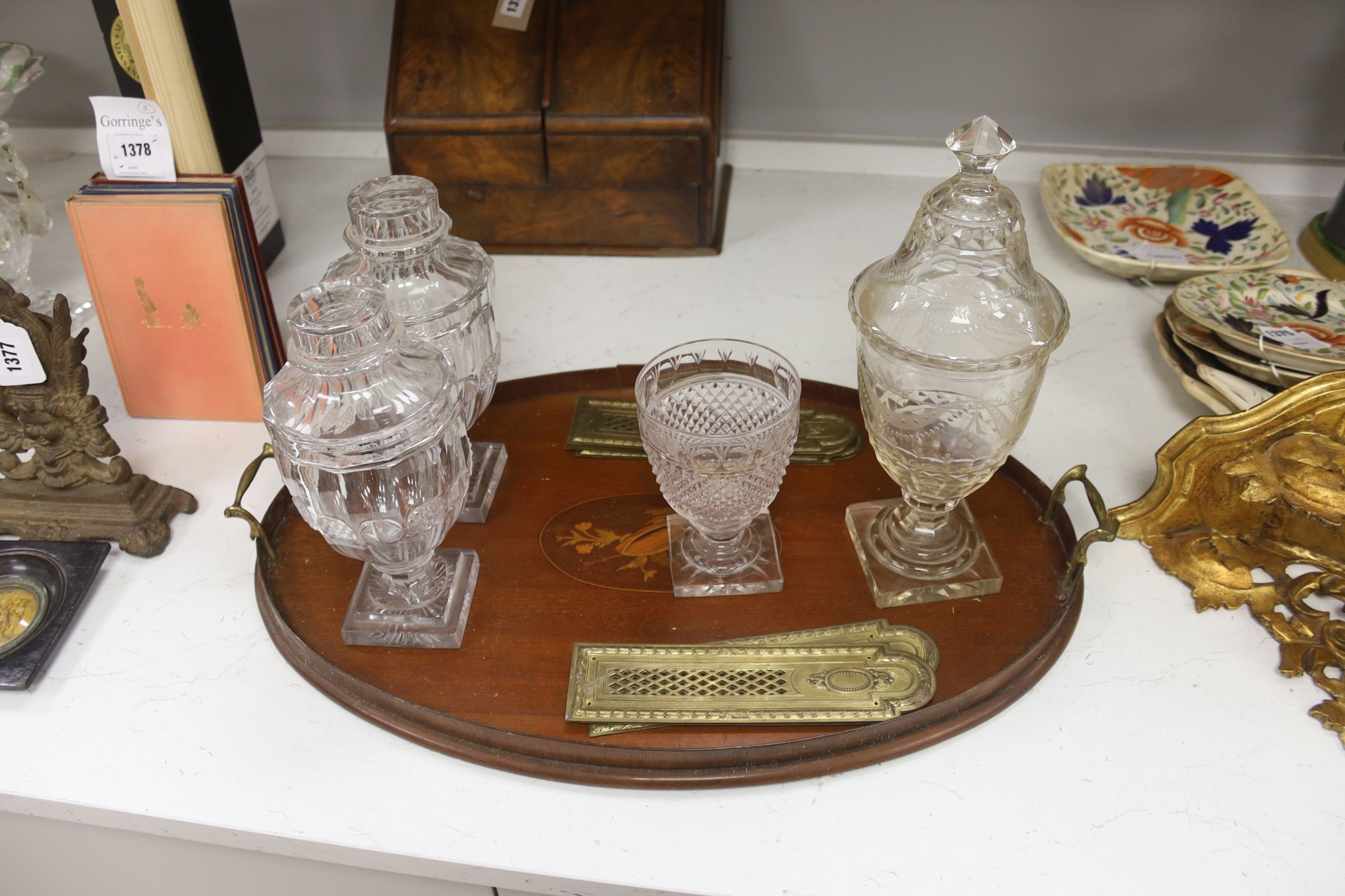 A Victorian walnut stationary cabinet, an Edwardian inlaid oval tray and a group 7 brass fingerplates